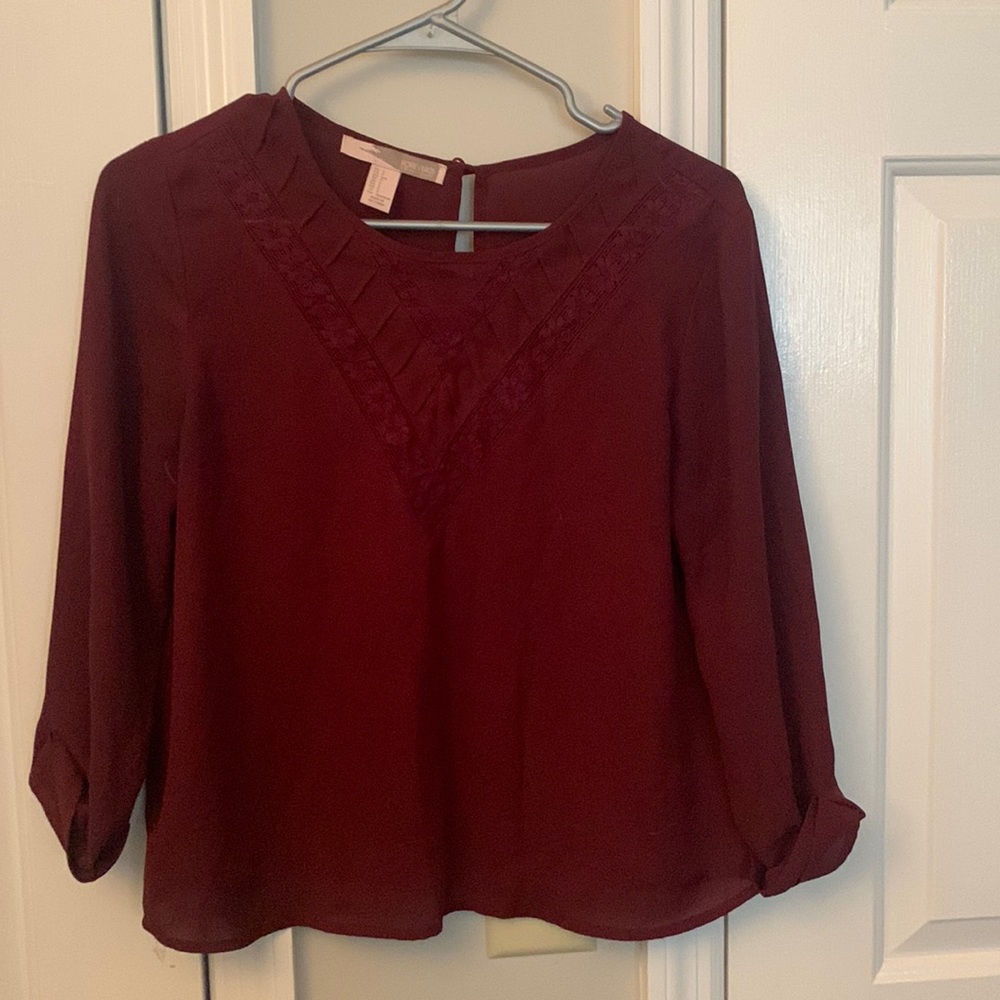 Red top maroon long sleeves
